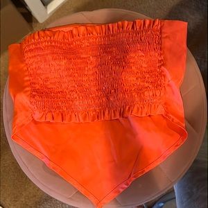 This is a bright orange crop top! For the ladies